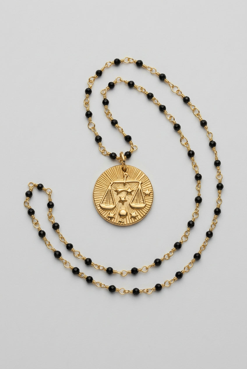 Zodiac necklace on a blue goldstone beaded chain