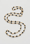 Blue goldstone beaded chain close-up