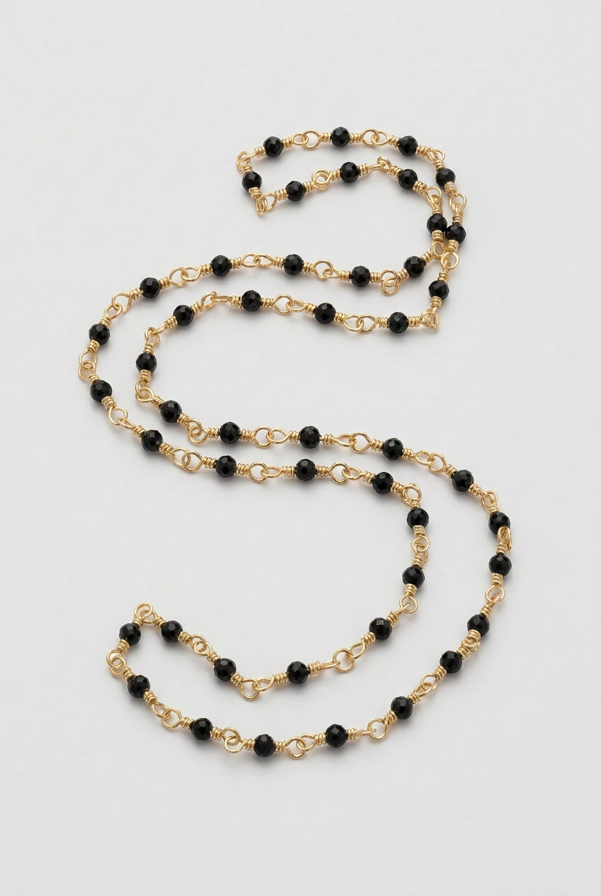Blue goldstone beaded chain close-up